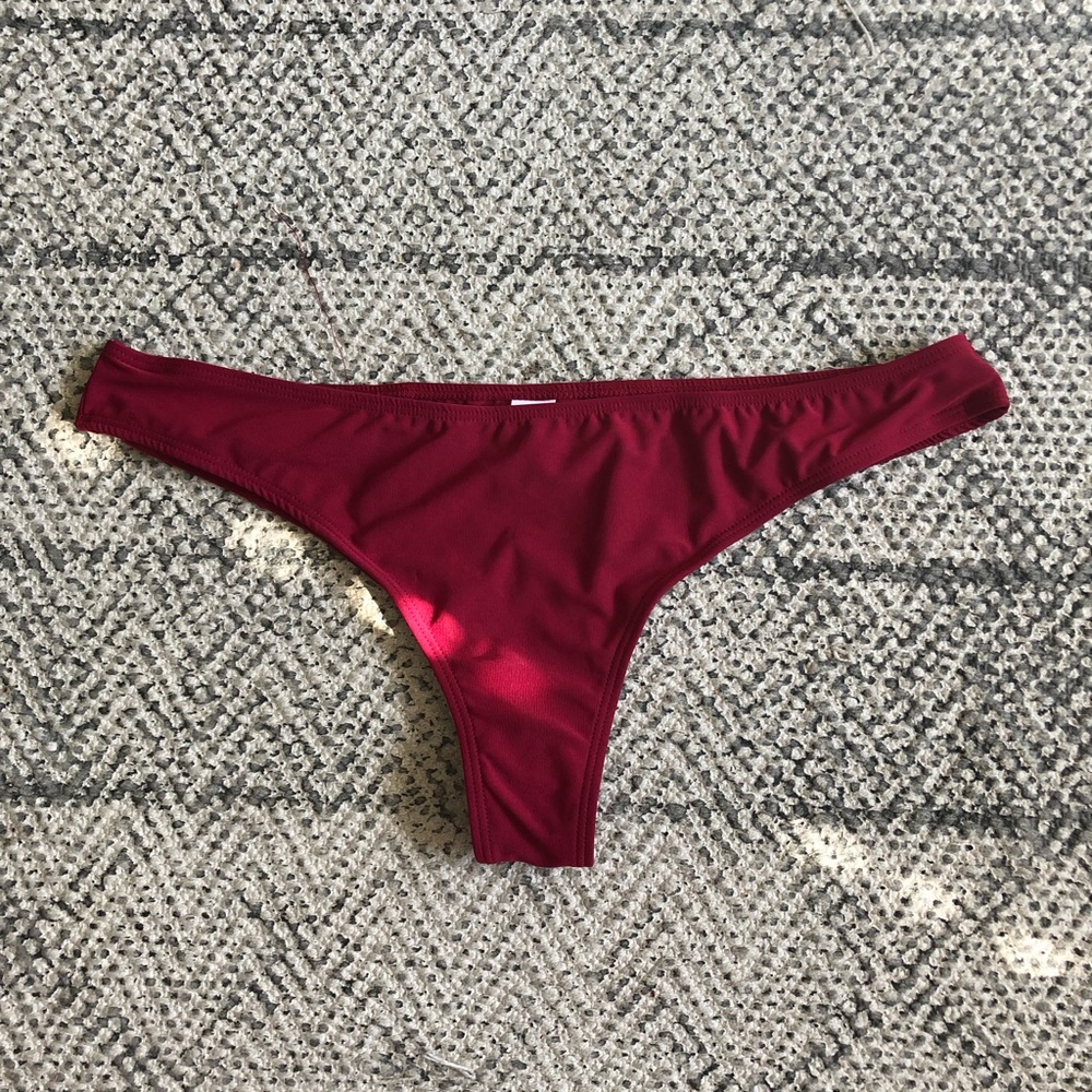 NEVER WORN- thong type cheeky swim bottoms